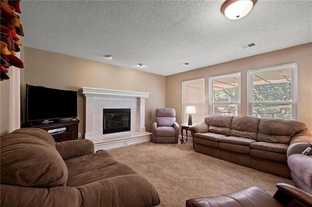 12434 England St, Overland Park, KS 66213 - carpeted living area with a tile fireplace and a textured ceiling