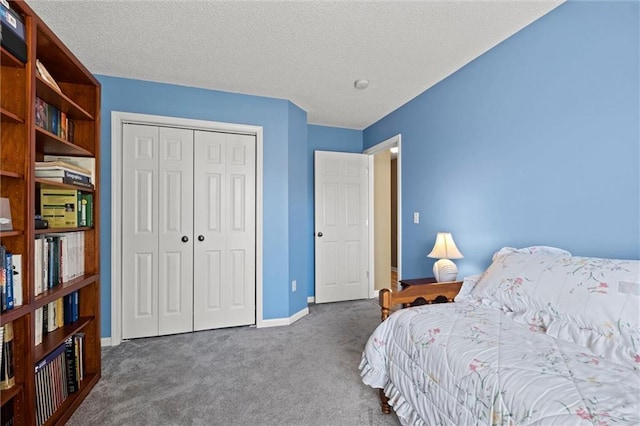 12434 England St, Overland Park, KS 66213 - bedroom with dark colored carpet, a closet, baseboards, and a textured ceiling