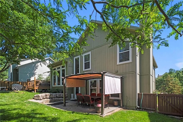 12434 England St, Overland Park, KS 66213 - rear view of property with a patio area and a deck