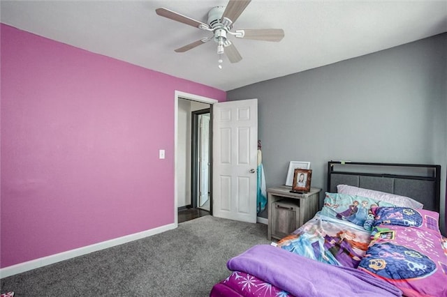 carpeted bedroom featuring baseboards and ceiling fan