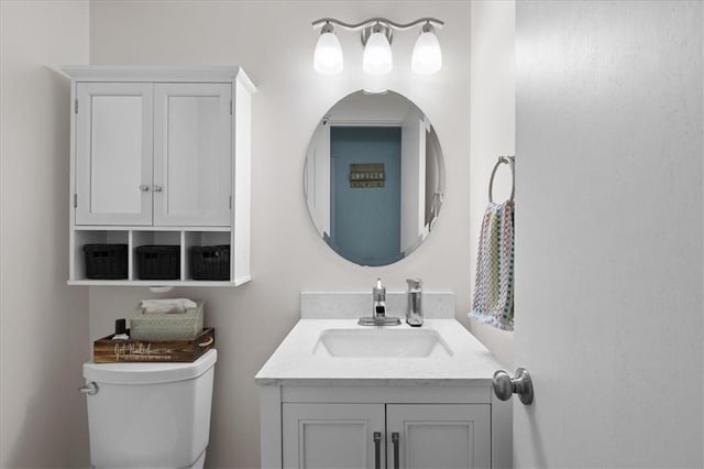 613 NE 90th Ter, Kansas City, MO 64155 - bathroom featuring toilet and vanity
