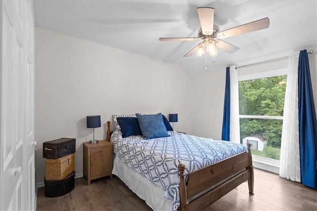 613 NE 90th Ter, Kansas City, MO 64155 - bedroom with wood finished floors, lofted ceiling, and ceiling fan