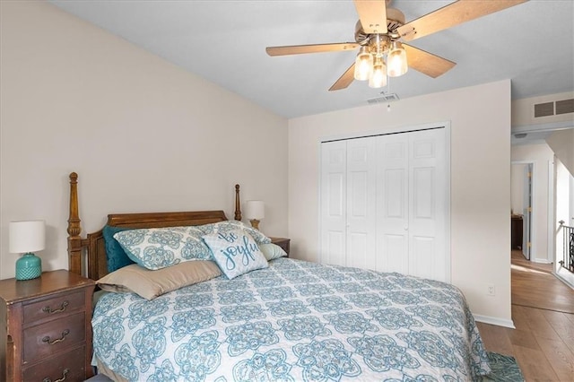 613 NE 90th Ter, Kansas City, MO 64155 - bedroom featuring wood finished floors, a closet, and ceiling fan