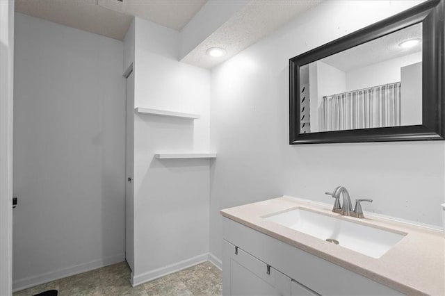 613 NE 90th Ter, Kansas City, MO 64155 - bathroom with vanity, recessed lighting, and a textured ceiling
