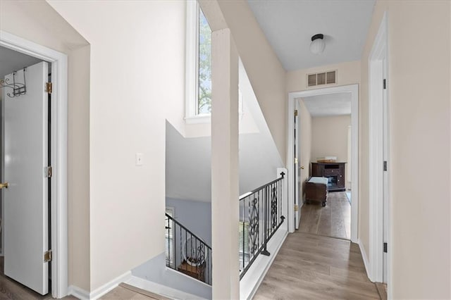 613 NE 90th Ter, Kansas City, MO 64155 - hall with an upstairs landing and wood finished floors
