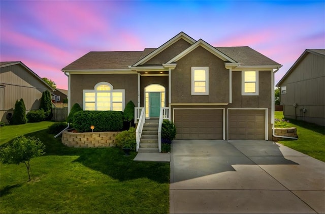 803 Crestridge Dr, Kearney, MO 64060 - view of front of property with a yard, a garage, concrete driveway, and stucco siding