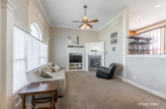 803 Crestridge Dr, Kearney, MO 64060 - carpeted living area featuring a glass covered fireplace, a ceiling fan, and crown molding