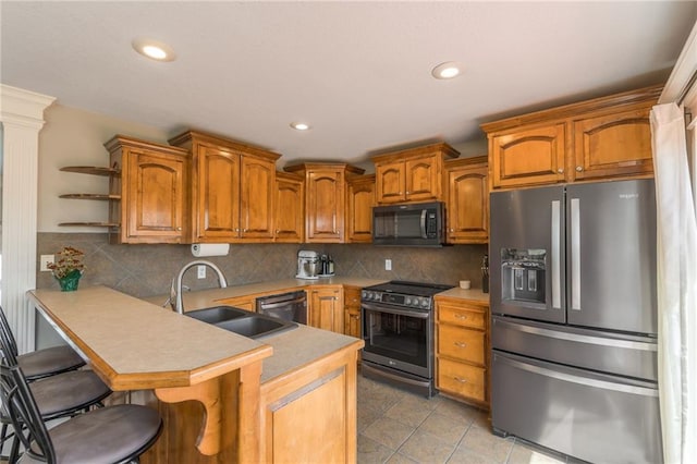 803 Crestridge Dr, Kearney, MO 64060 - kitchen featuring stainless steel appliances, a peninsula, brown cabinetry, open shelves, and recessed lighting