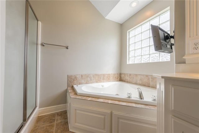 803 Crestridge Dr, Kearney, MO 64060 - bathroom featuring a garden tub, a shower with door, and tile patterned flooring