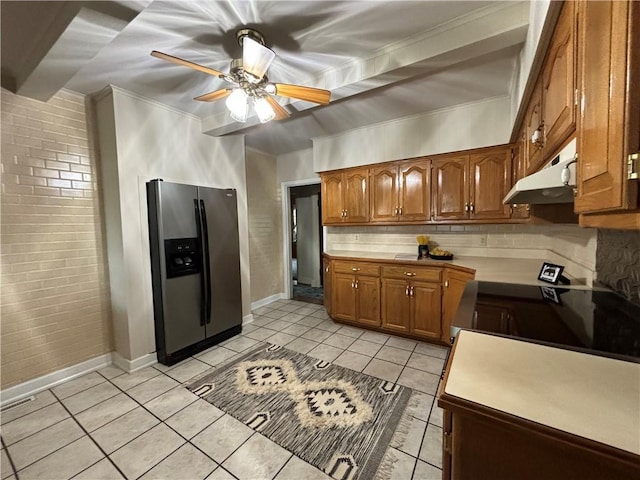 2702 Faraon St, Saint Joseph, MO 64501 - kitchen with stainless steel refrigerator with ice dispenser, under cabinet range hood, brown cabinetry, ceiling fan, and backsplash