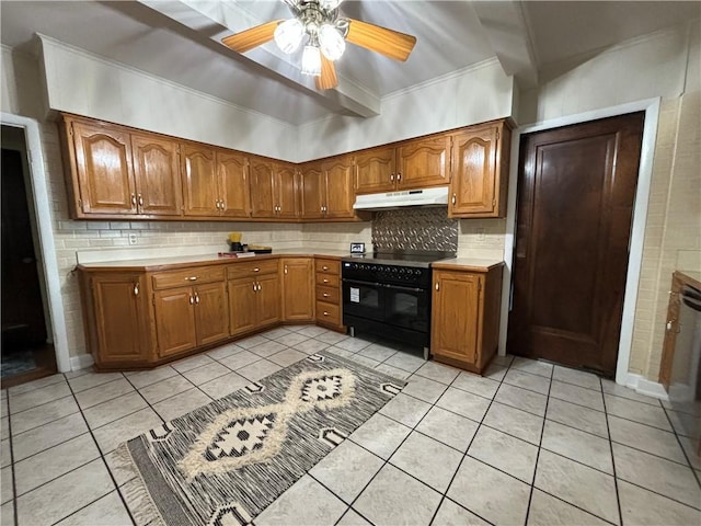 2702 Faraon St, Saint Joseph, MO 64501 - kitchen with double oven range, under cabinet range hood, brown cabinets, and crown molding