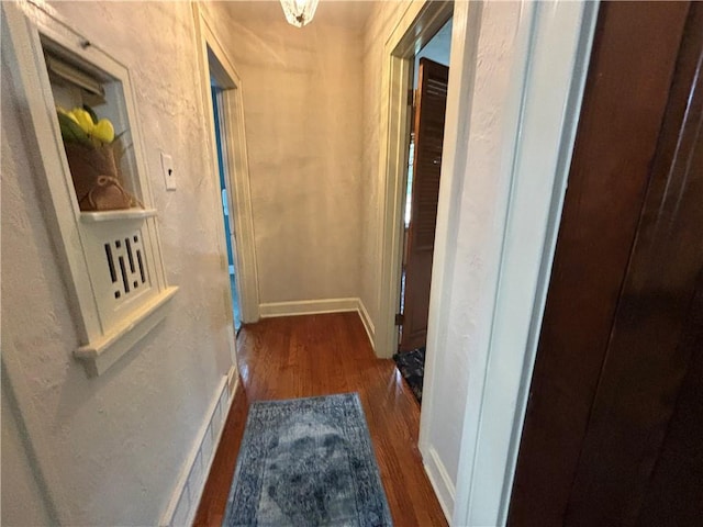 2702 Faraon St, Saint Joseph, MO 64501 - hallway featuring wood finished floors and baseboards