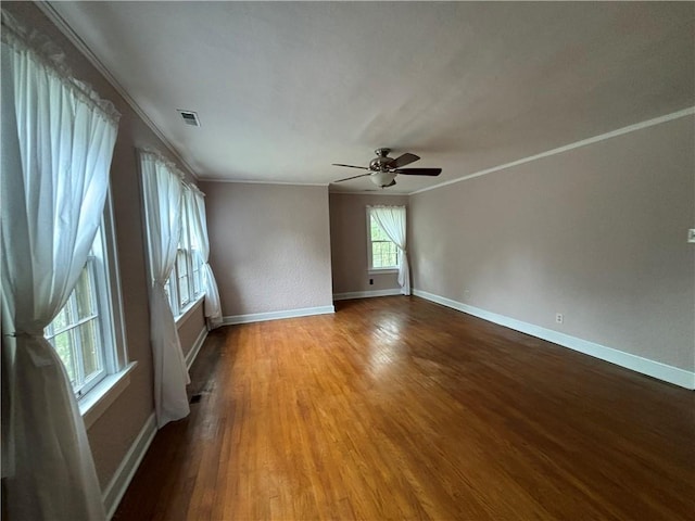 2702 Faraon St, Saint Joseph, MO 64501 - unfurnished room with ornamental molding, ceiling fan, wood finished floors, and baseboards