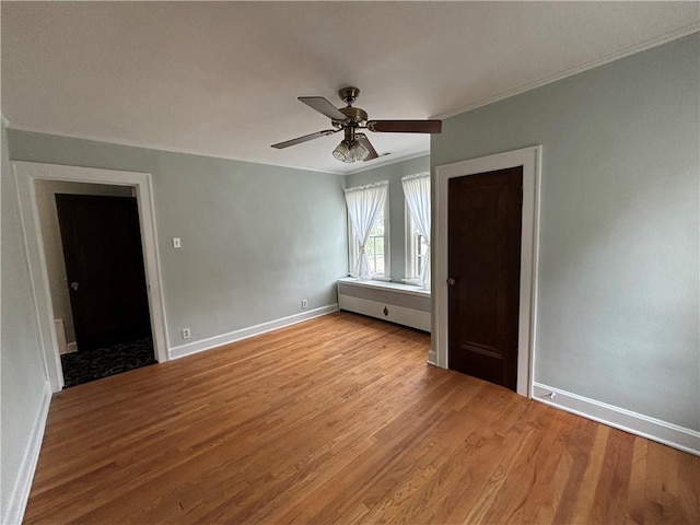 2702 Faraon St, Saint Joseph, MO 64501 - unfurnished room featuring ornamental molding, light wood-style flooring, a ceiling fan, and baseboards