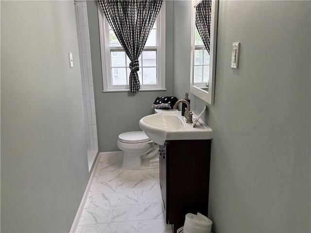 2702 Faraon St, Saint Joseph, MO 64501 - full bathroom featuring marble look tile flooring, toilet, vanity, and a walk in shower