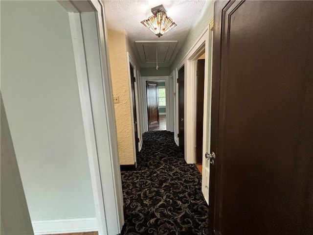 2702 Faraon St, Saint Joseph, MO 64501 - hallway featuring attic access and dark carpet