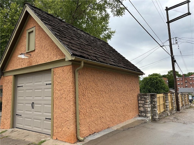 2702 Faraon St, Saint Joseph, MO 64501 - view of side of property with stucco siding and an outdoor structure