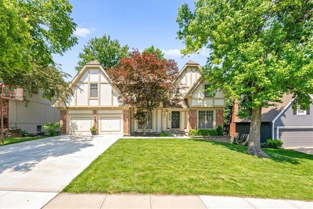 12224 Connell Dr, Overland Park, KS 66213 - tudor house with driveway, a front lawn, brick siding, and an attached garage