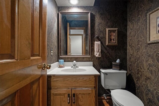 12224 Connell Dr, Overland Park, KS 66213 - bathroom with wallpapered walls and vanity
