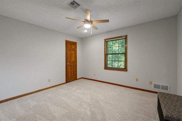 12224 Connell Dr, Overland Park, KS 66213 - unfurnished room with carpet floors, ceiling fan, and a textured ceiling