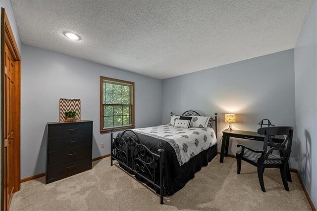 12224 Connell Dr, Overland Park, KS 66213 - bedroom with carpet floors and a textured ceiling