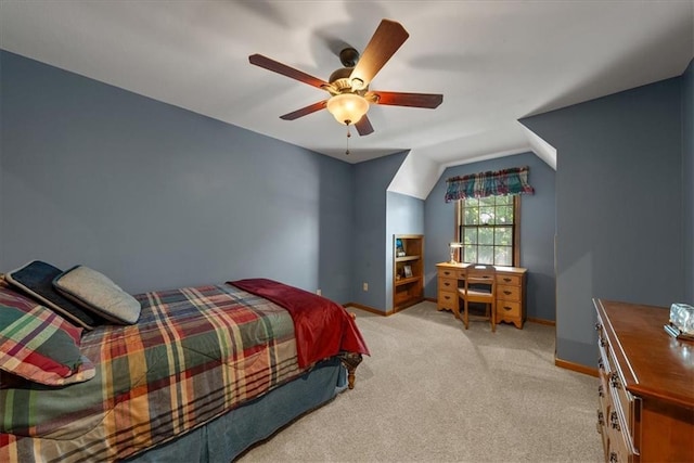 12224 Connell Dr, Overland Park, KS 66213 - bedroom with vaulted ceiling, light carpet, and a ceiling fan