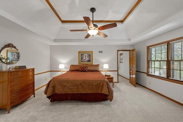 12224 Connell Dr, Overland Park, KS 66213 - bedroom with a raised ceiling, light colored carpet, and a ceiling fan