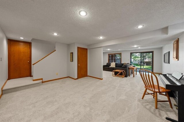 12224 Connell Dr, Overland Park, KS 66213 - living room with a textured ceiling, light colored carpet, recessed lighting, and stairs