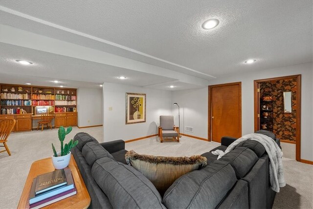 12224 Connell Dr, Overland Park, KS 66213 - living room featuring light colored carpet, a textured ceiling, and recessed lighting