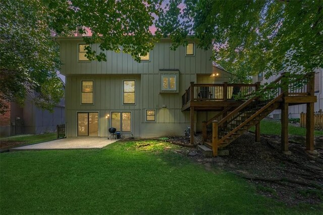 12224 Connell Dr, Overland Park, KS 66213 - back of property with stairs, a deck, a patio area, and board and batten siding