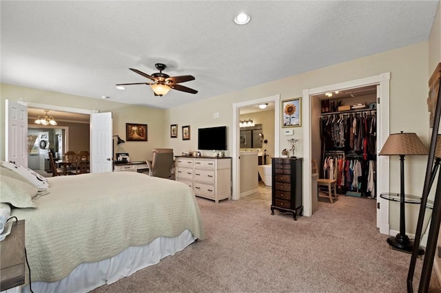 13223 Gammon Rd, Lees Summit, MO 64086 - bedroom featuring light carpet, a walk in closet, a closet, ensuite bathroom, and a chandelier