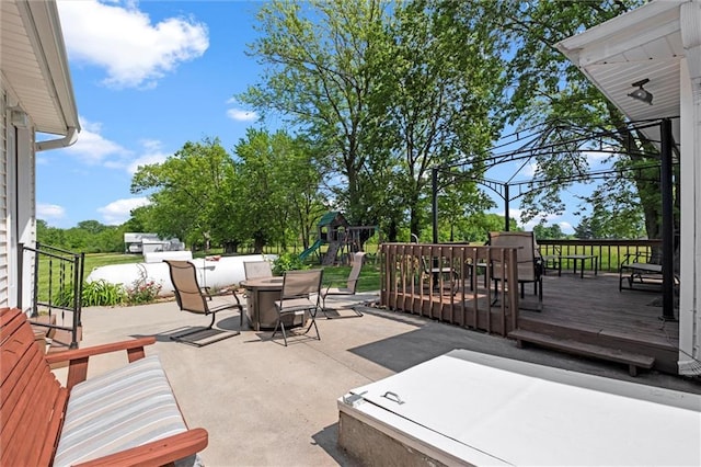 13223 Gammon Rd, Lees Summit, MO 64086 - view of patio featuring outdoor dining space, a playground, and a deck