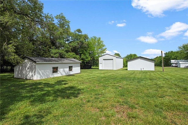 13223 Gammon Rd, Lees Summit, MO 64086 - view of green lawn featuring a garage