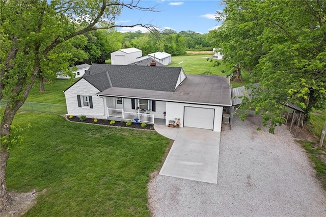 13223 Gammon Rd, Lees Summit, MO 64086 - view of front facade with covered porch, a garage, and driveway