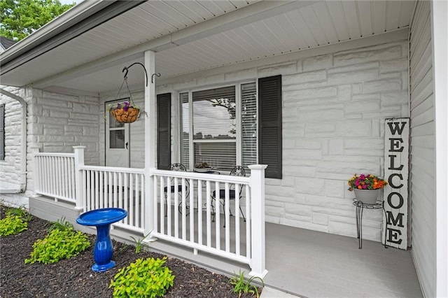 13223 Gammon Rd, Lees Summit, MO 64086 - property entrance featuring a porch and stone siding