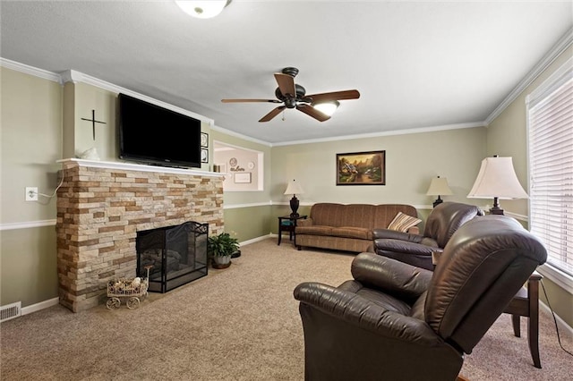 13223 Gammon Rd, Lees Summit, MO 64086 - living room with carpet floors, ceiling fan, baseboards, a stone fireplace, and crown molding