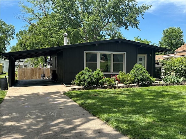 view of front of house with a carport and driveway
