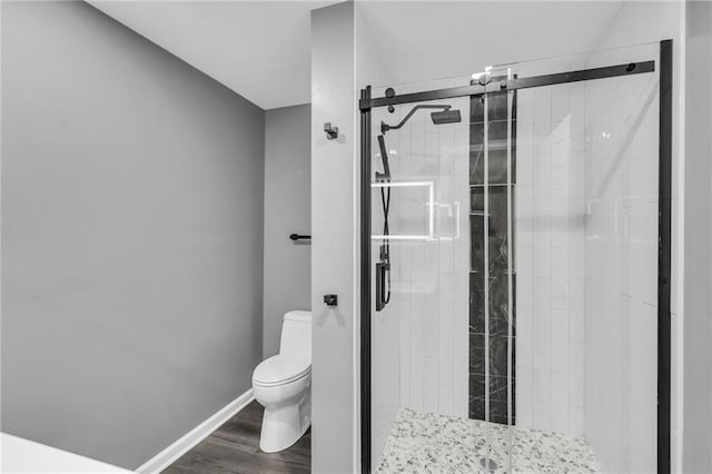 6531 W 49th St, Mission, KS 66202 - full bathroom with toilet, a stall shower, wood finished floors, and baseboards