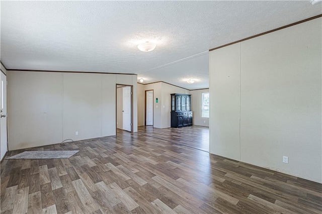 549 N Linn Valley Dr, Linn Valley, KS 66040 - empty room featuring ornamental molding, wood finished floors, and a textured ceiling