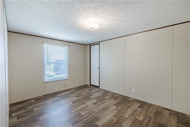 549 N Linn Valley Dr, Linn Valley, KS 66040 - spare room featuring wood finished floors and a textured ceiling