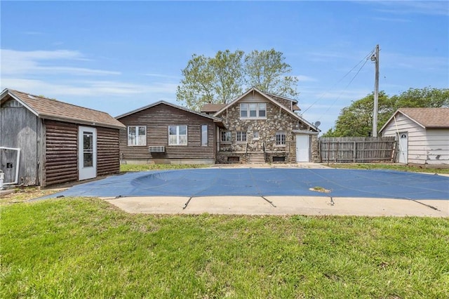 view of pool featuring a storage shed, an outbuilding, and a deck