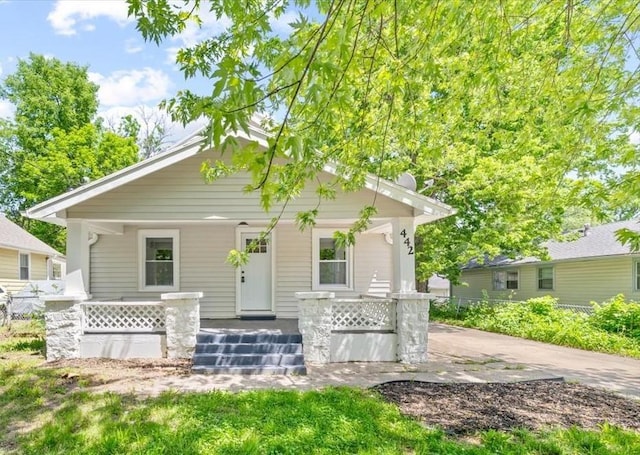 442 Michigan St, Lawrence, KS 66044 - view of front facade featuring a porch and fence