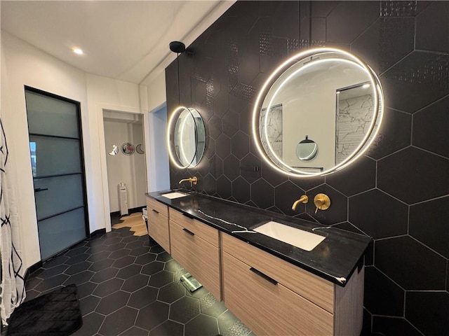 8890 Mccoy St, Lenexa, KS 66227 - full bath with double vanity, decorative backsplash, tile patterned floors, recessed lighting, and radiator