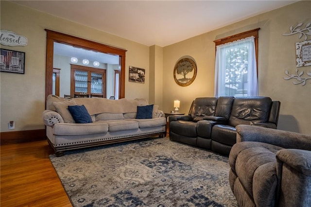 203 S Hughes St, Hamilton, MO 64644 - living area featuring wood finished floors and baseboards
