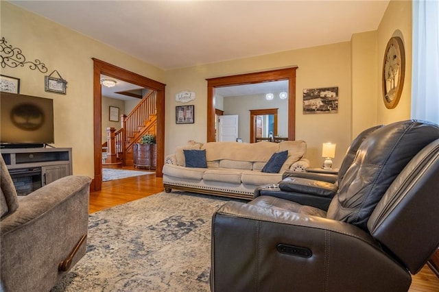 203 S Hughes St, Hamilton, MO 64644 - living room featuring wood finished floors and stairway
