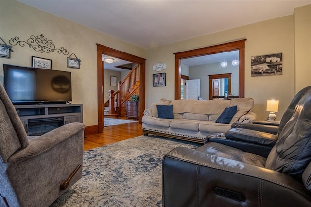 203 S Hughes St, Hamilton, MO 64644 - living room with wood finished floors and stairway