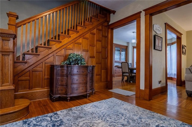 203 S Hughes St, Hamilton, MO 64644 - stairway with hardwood / wood-style flooring and baseboards