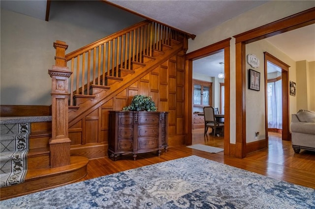 203 S Hughes St, Hamilton, MO 64644 - staircase featuring wood finished floors