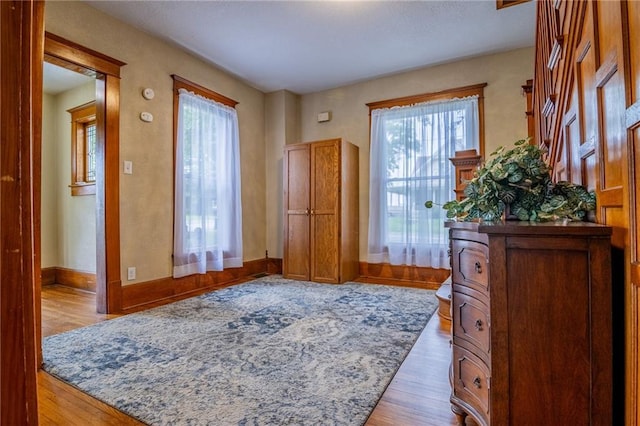 203 S Hughes St, Hamilton, MO 64644 - entrance foyer with wood finished floors and baseboards