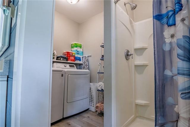 203 S Hughes St, Hamilton, MO 64644 - laundry area featuring washing machine and clothes dryer and light wood-style floors